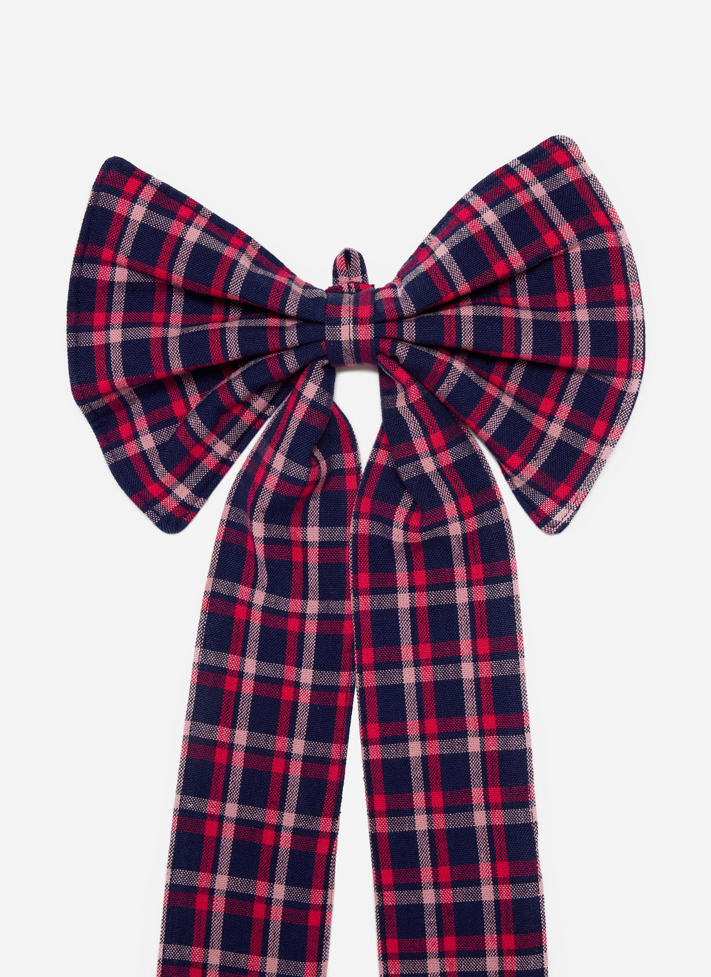 Close-up of the navy plaid cotton bow showing the full loops and pink stripe detail