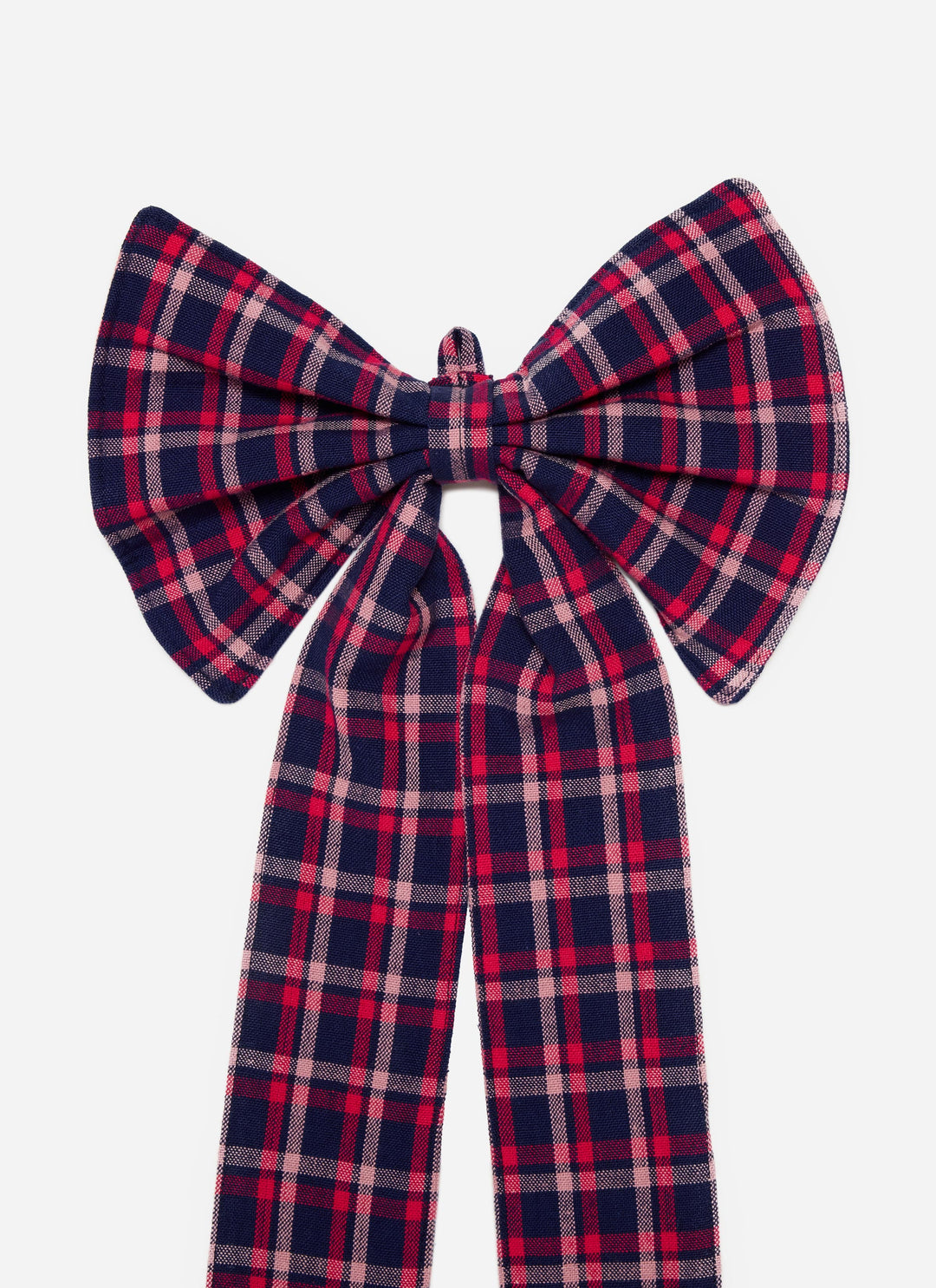 Close-up of the navy plaid cotton bow showing the full loops and pink stripe detail