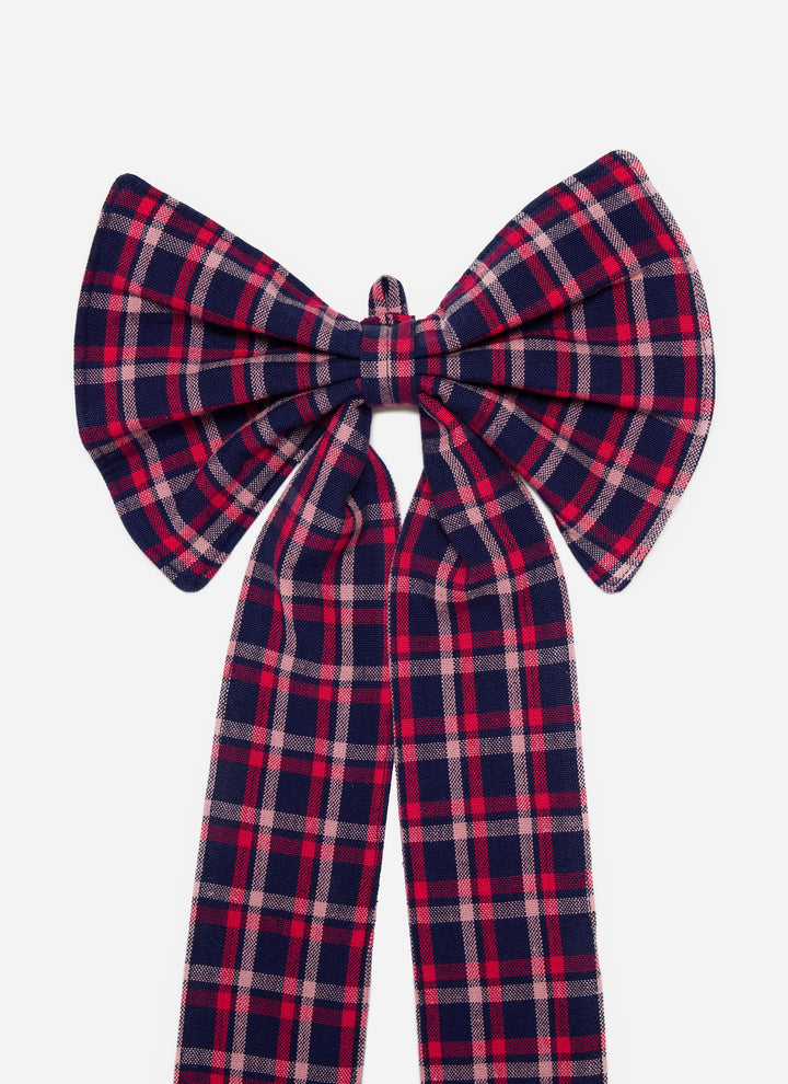 Close-up of the navy plaid cotton bow showing the full loops and pink stripe detail