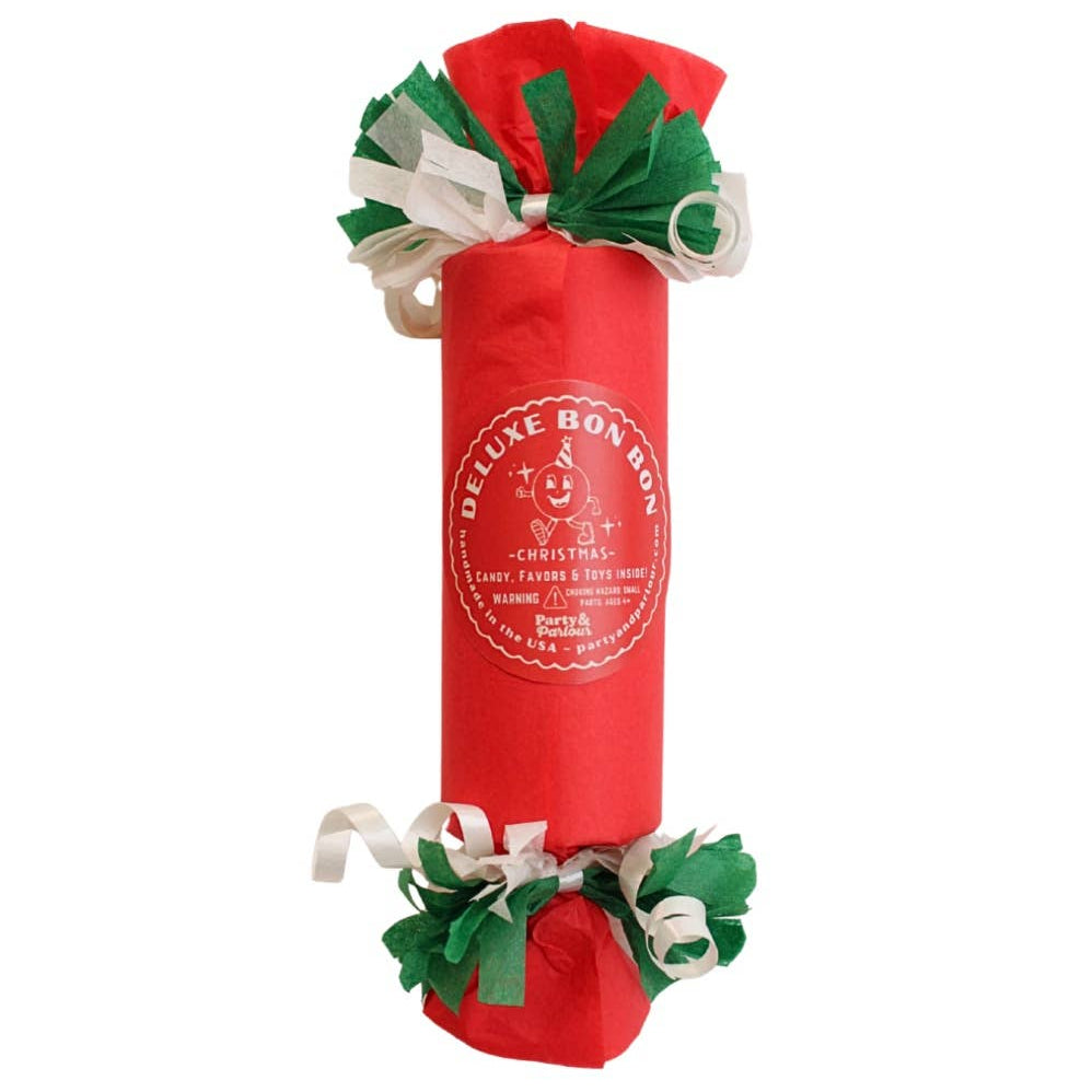 Red Deluxe Bon Bon party favor with a white seal label and green and white fringed paper ends, for a Christmas party
