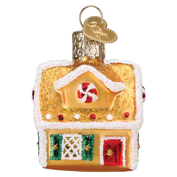 Mini gingerbread house ornament, front view with red door, green shutters, and peppermint swirl, on white