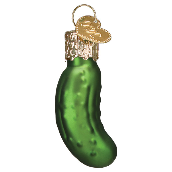 Mini green glass pickle ornament with a glossy bumpy finish and gold cap, on white
