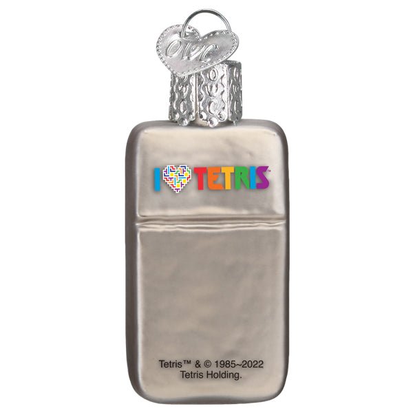 Back of the mini Tetris ornament showing the rainbow Tetris logo on a silver case, on white