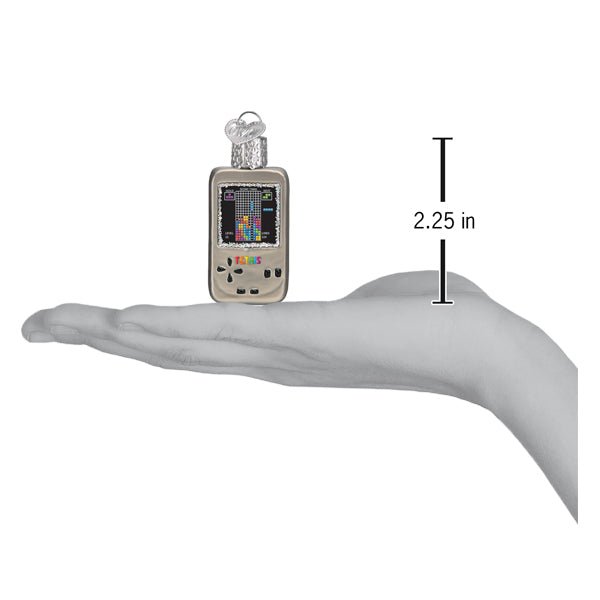 Mini Tetris ornament on an open palm beside a 2.25 inch height marker