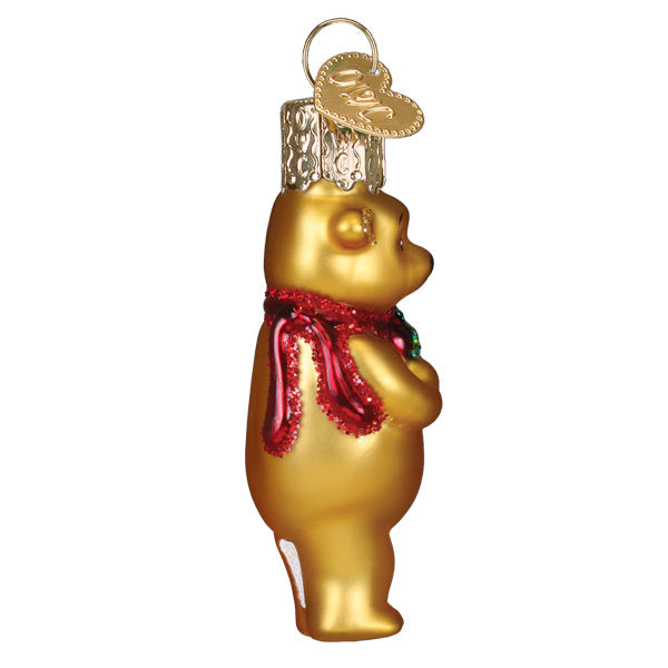 Mini Winnie the Pooh glass ornament holding a gift for a Christmas tree