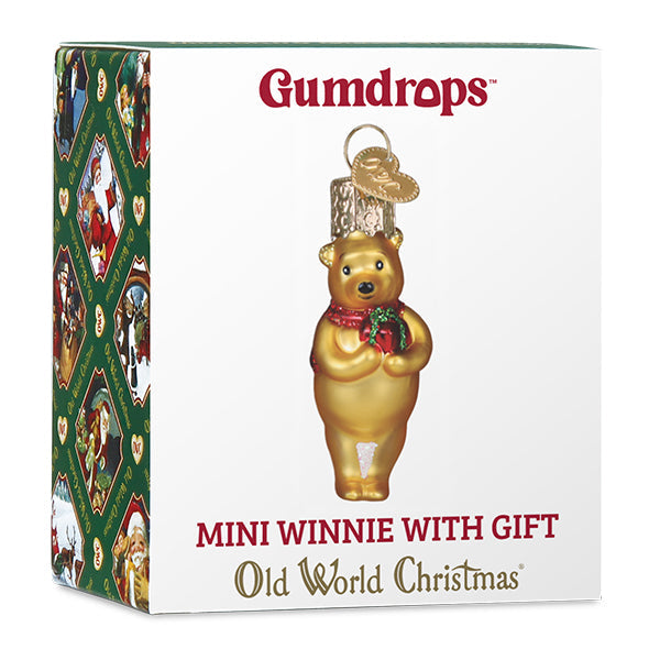 Mini Winnie the Pooh glass ornament holding a gift for a Christmas tree