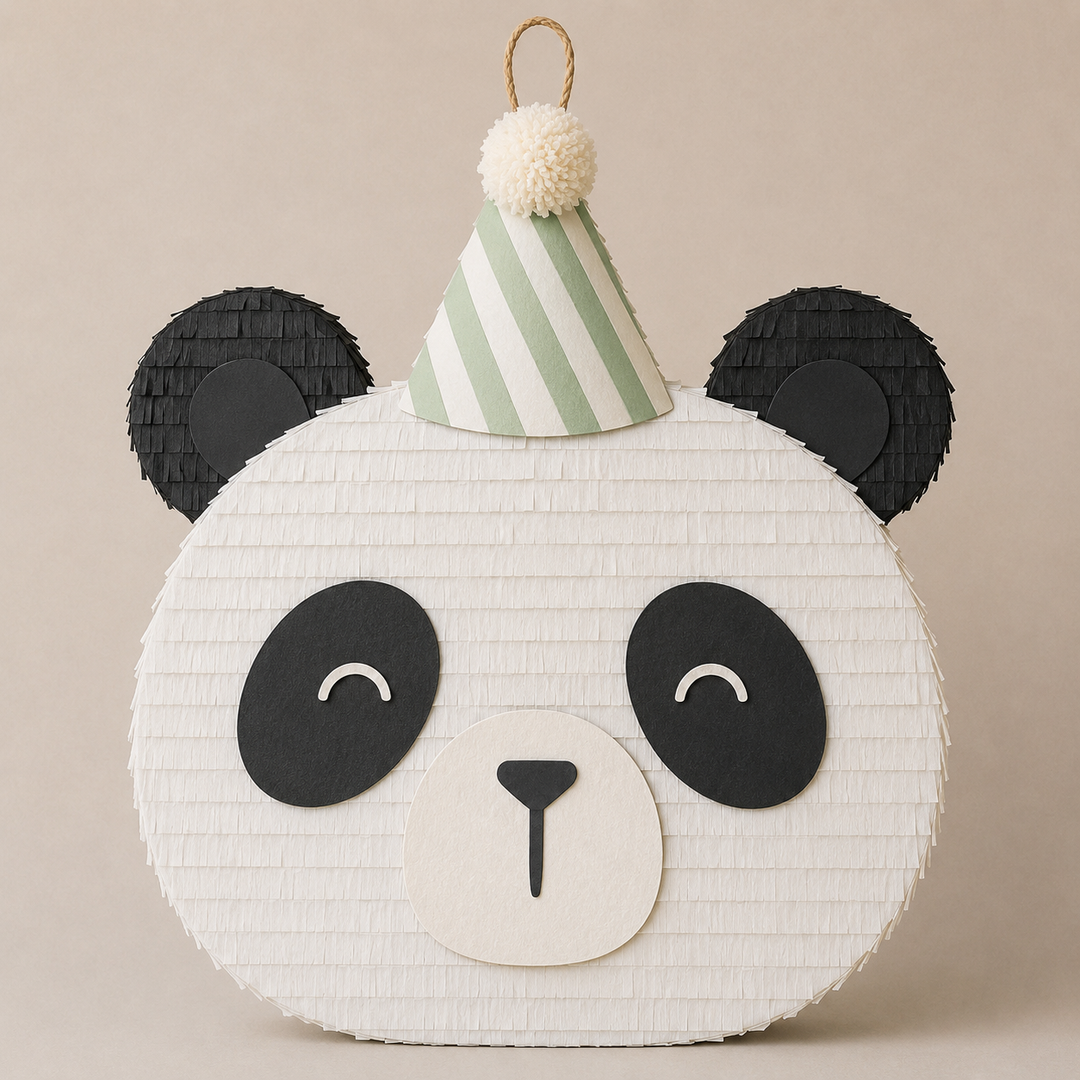 Round panda face piñata in white with black ears and eye patches and a green striped party hat, for a panda birthday