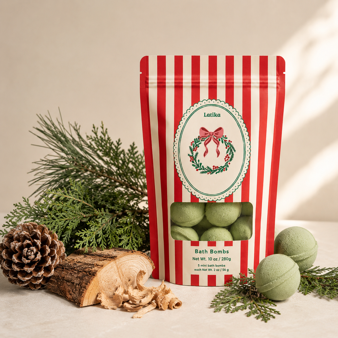 Wreath bath bomb pouch styled with wood, pinecones and loose green minis, a woodsy Christmas gift