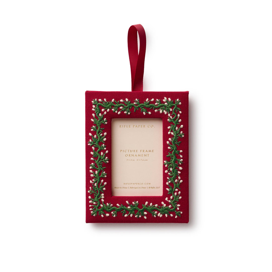 Red bookcloth photo frame ornament with embroidered green vine and berry buds, holds a 2x3 photo for the tree