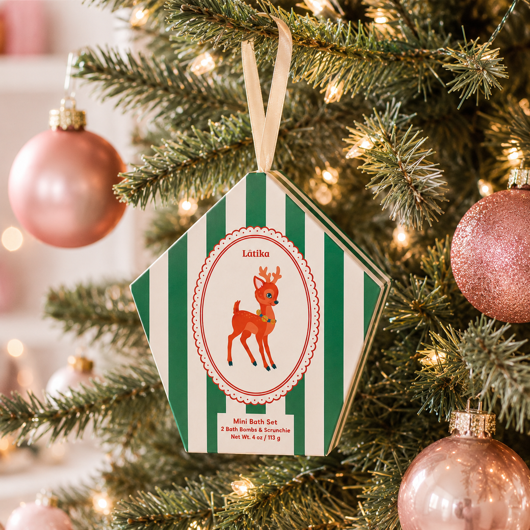 Baby deer ornament box hanging on a lit Christmas tree with pink baubles, a ready-to-hang stocking stuffer