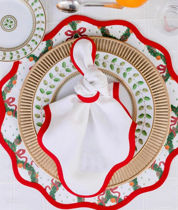 Round scalloped Christmas placemat in the Holiday Wreath print, Rosebud Red