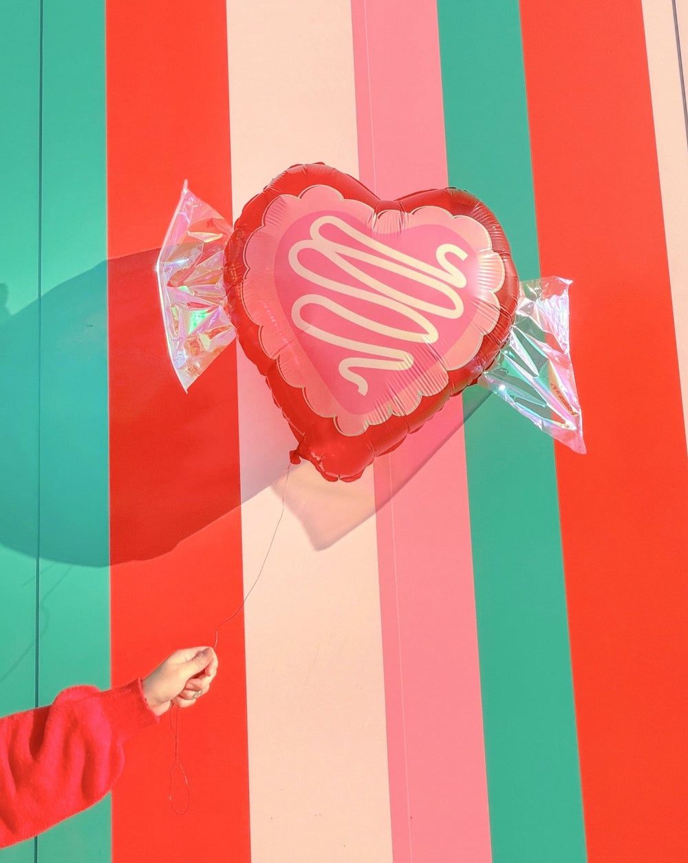 Valentine candy balloons with silver iridescent foil accents and 50 inch coordinating ribbons