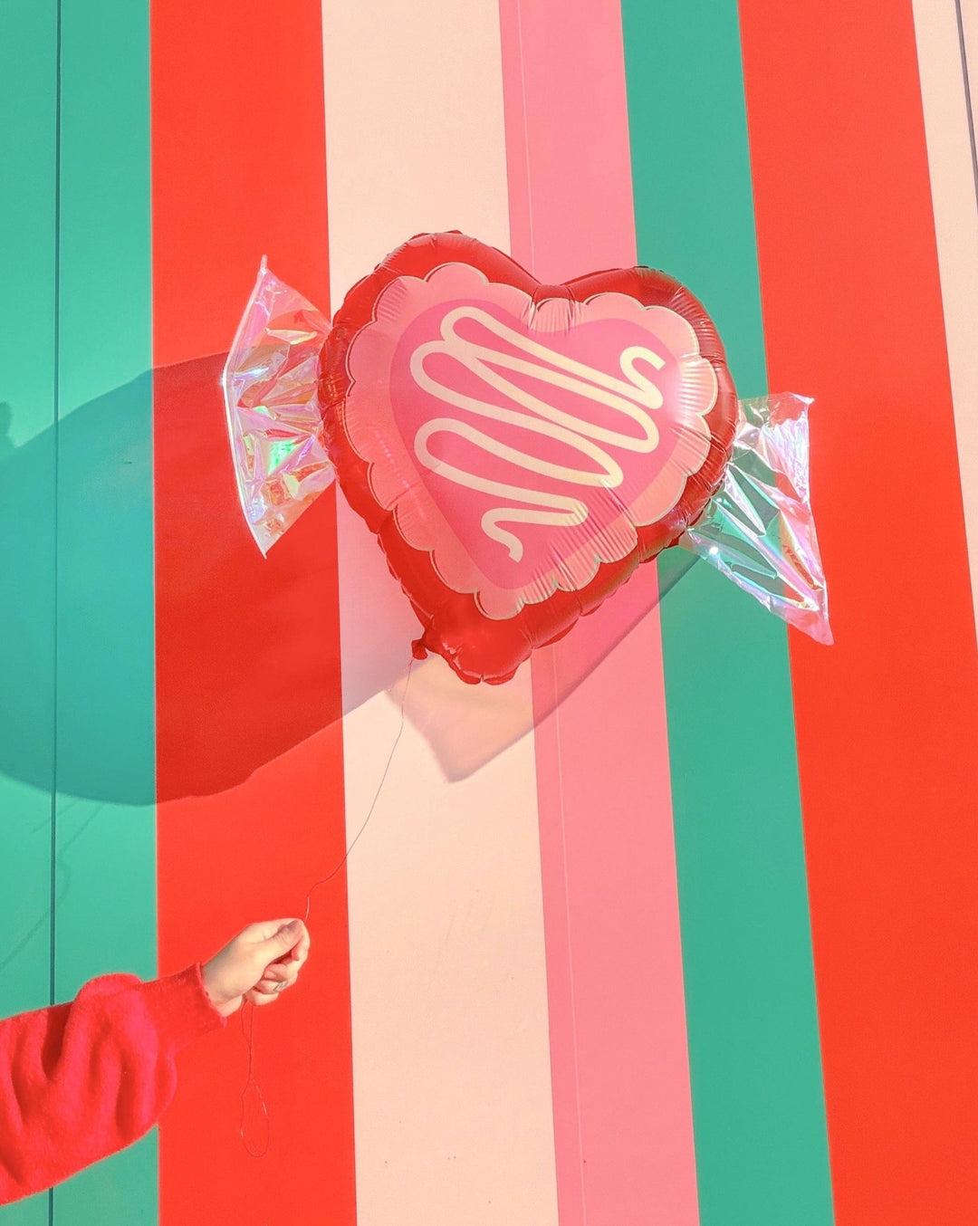 Valentine candy balloons with silver iridescent foil accents and 50 inch coordinating ribbons