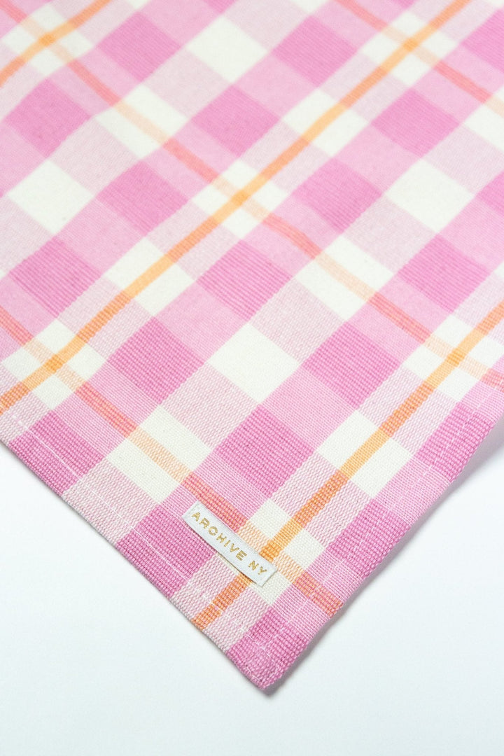 Close-up of bubblegum and peach handwoven cotton plaid weave