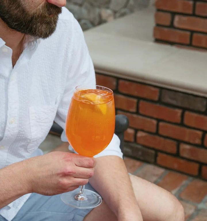 Aperitivo spritzes styled with fresh oranges for summer entertaining