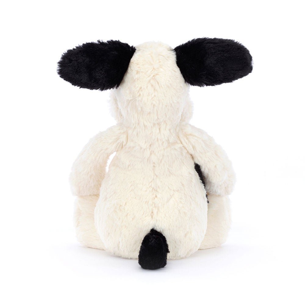 Jellycat Bashful Black and Cream Puppy plush, a cuddly stuffed animal gift for a birthday or baby shower.