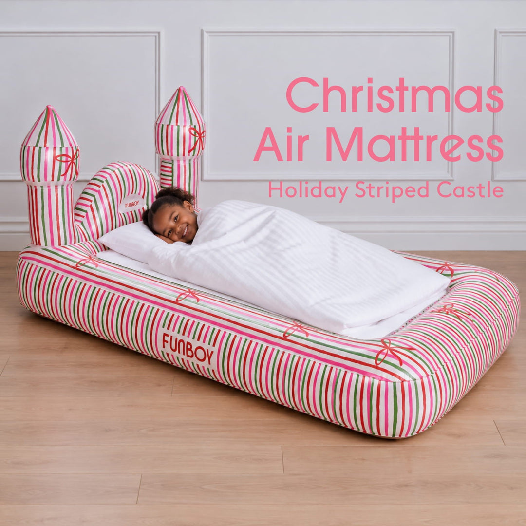 Holiday stripe castle kids air mattress with a child asleep, labeled Christmas air mattress