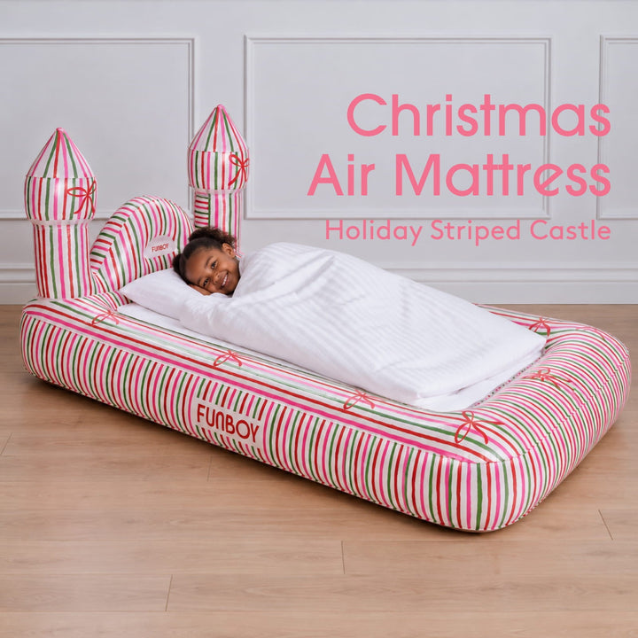 Holiday stripe castle kids air mattress with a child asleep, labeled Christmas air mattress