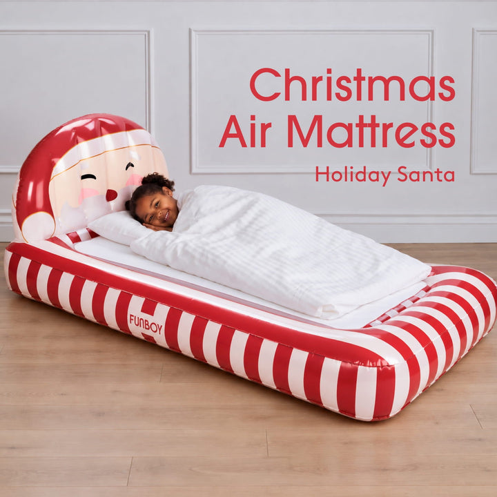 Santa kids air mattress with a child asleep, labeled Christmas air mattress