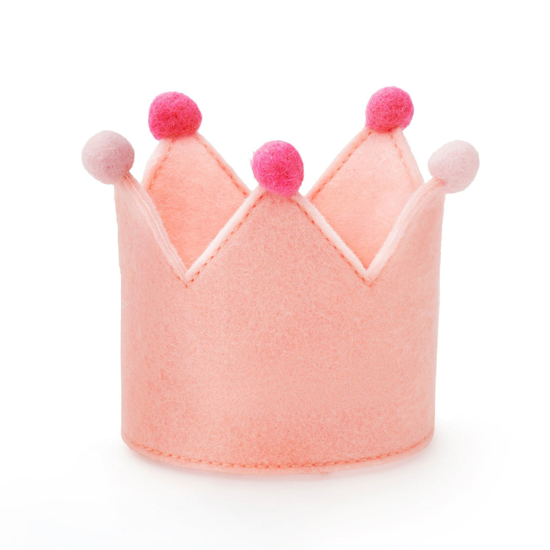 Plain blush pink felt dog birthday crown with hot pink and pale pink pom-poms, front view on white