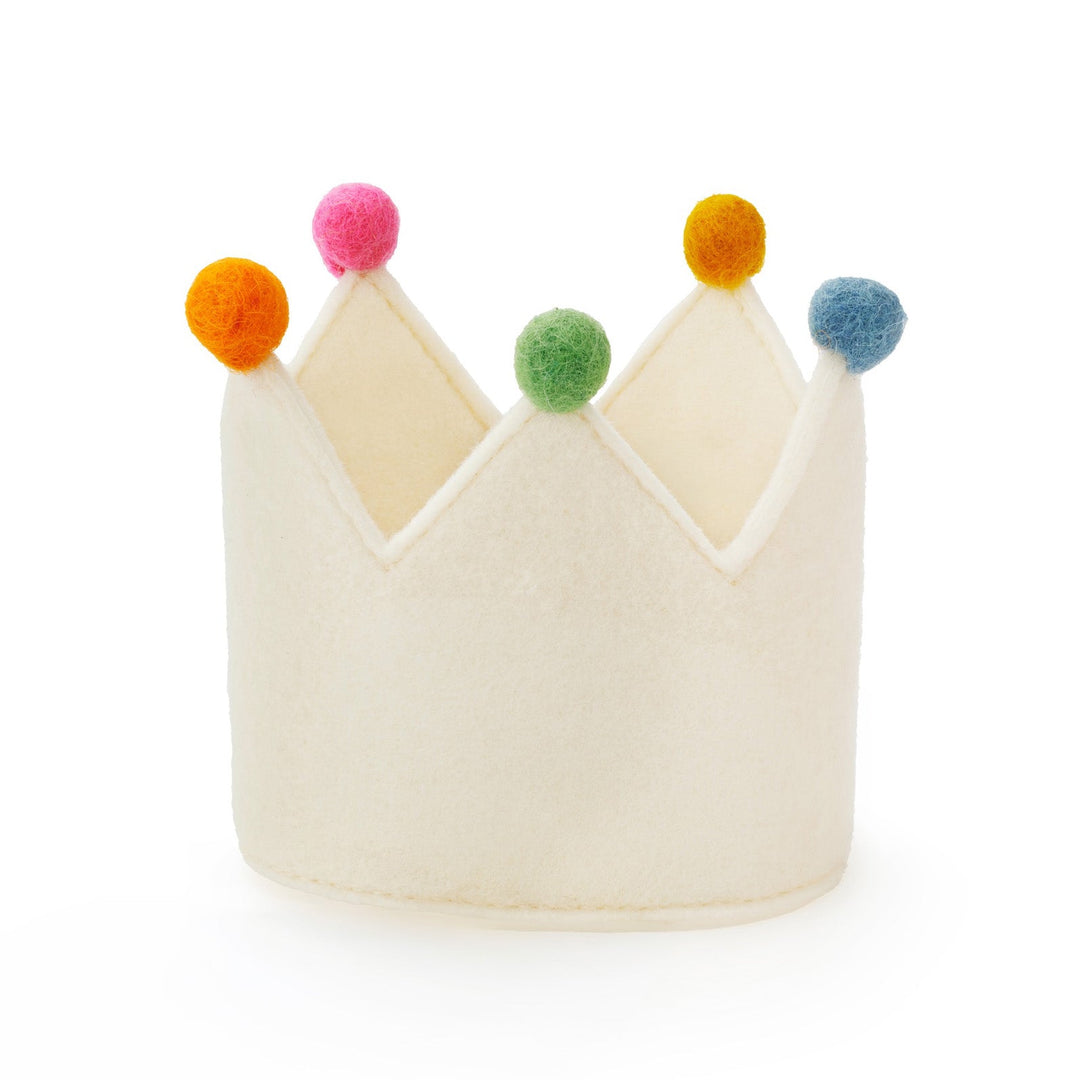 Plain ivory felt dog birthday crown with pink, orange, green, and blue pom-poms, front view on white