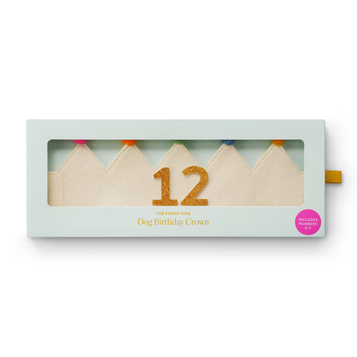 Ivory dog birthday crown with a gold 12 packed in its windowed mint keepsake box