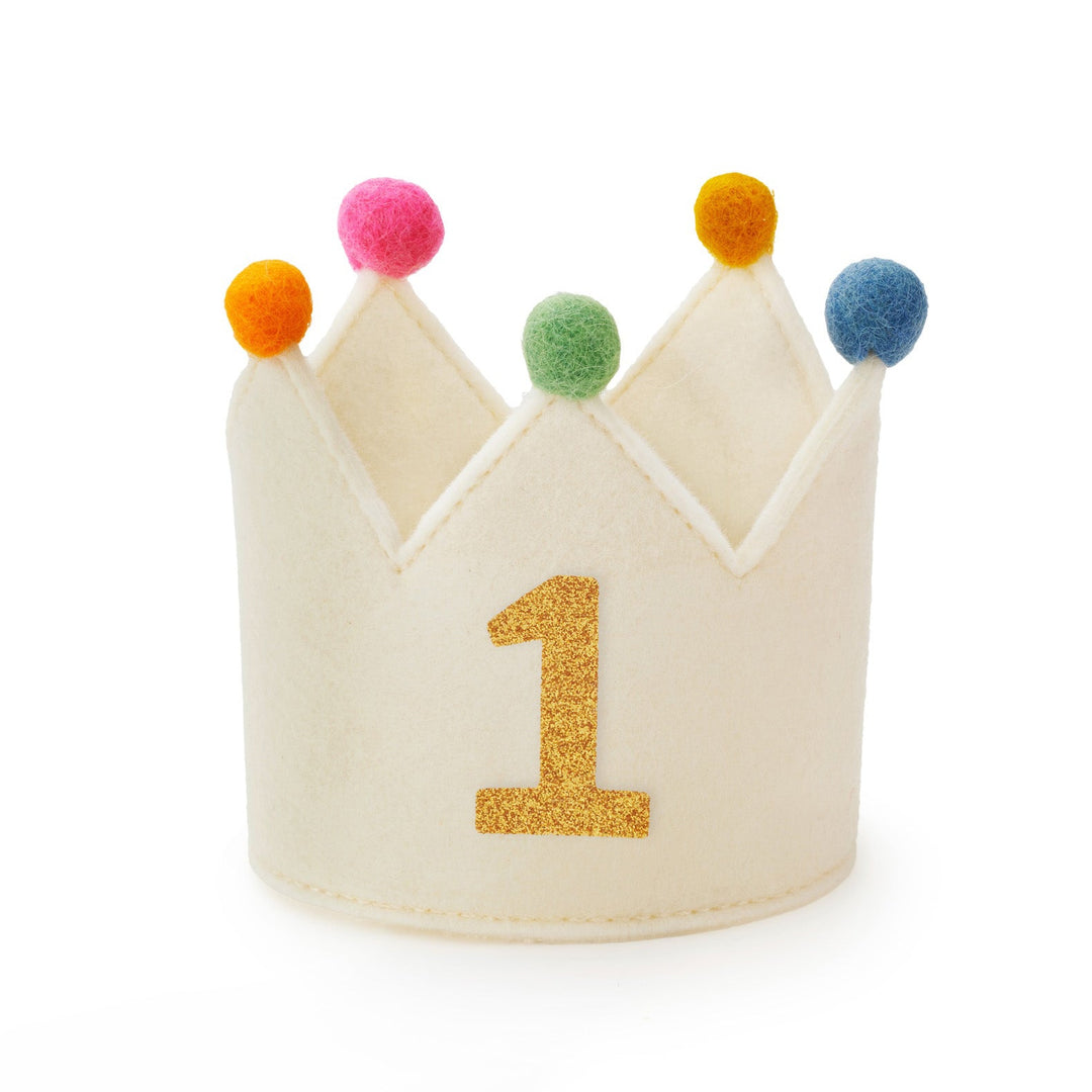 Ivory felt dog birthday crown with multicolor pom-poms and a gold glitter number 1, front view on white