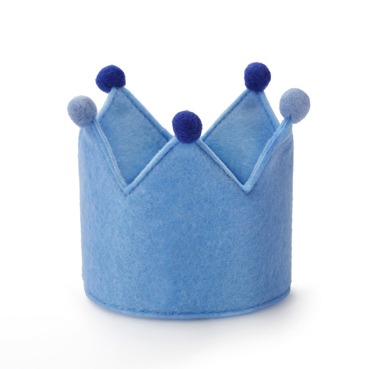 Light blue felt dog birthday crown with navy and periwinkle pom-poms, front view on white
