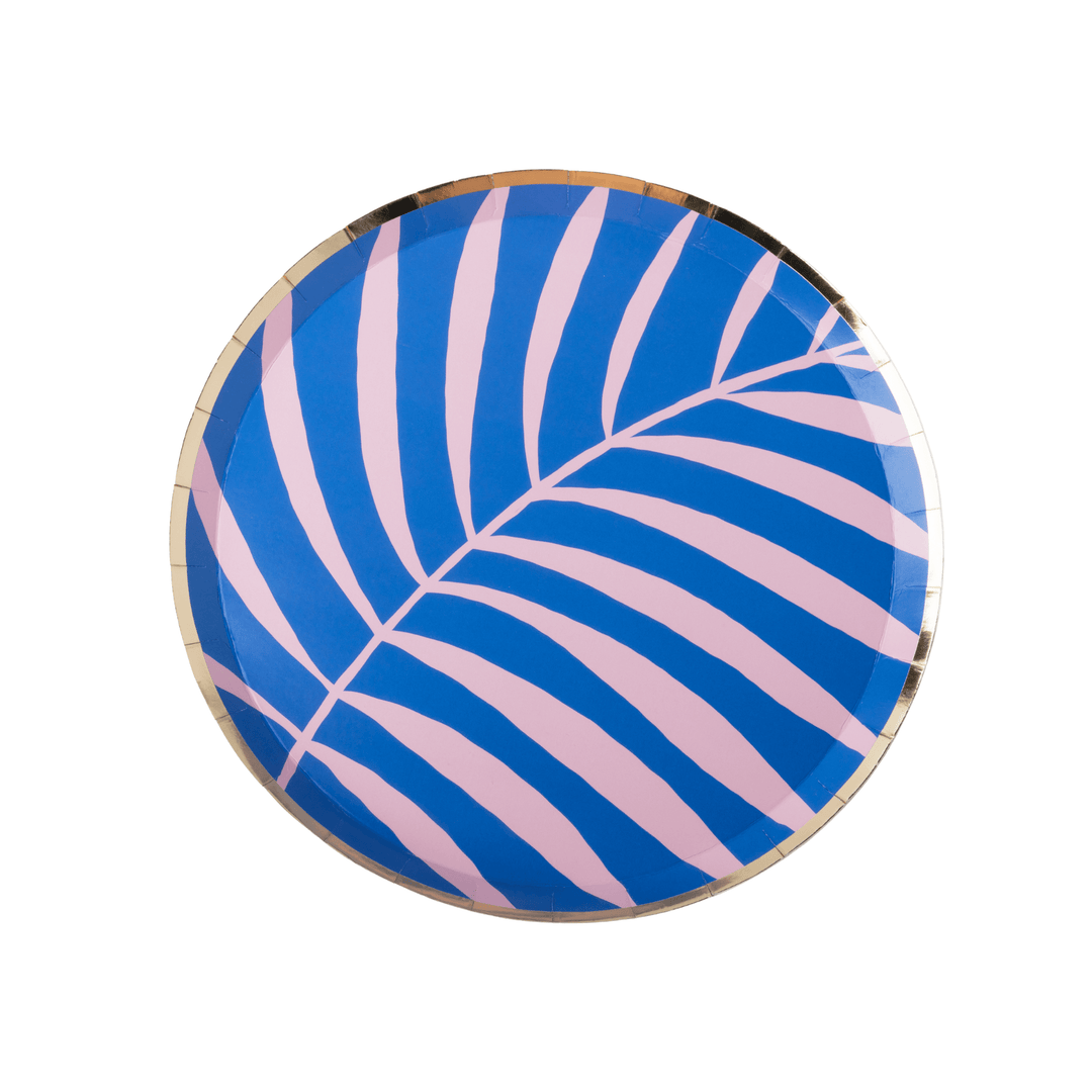 round paper plates featuring a blue and pink palm leaf pattern with a metallic gold rim, photographed on a clean white background.