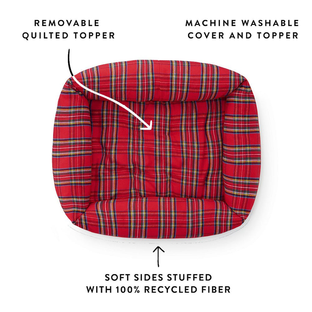 Top view of the red tartan bolster bed showing the quilted topper, washable cover, and stuffed sides