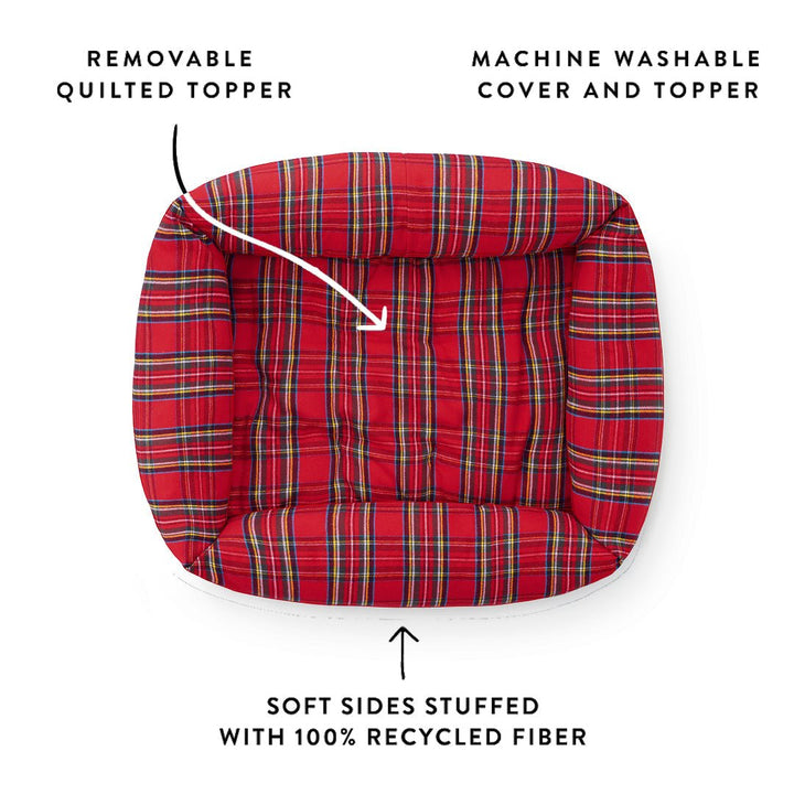 Top view of the red tartan bolster bed showing the quilted topper, washable cover, and stuffed sides