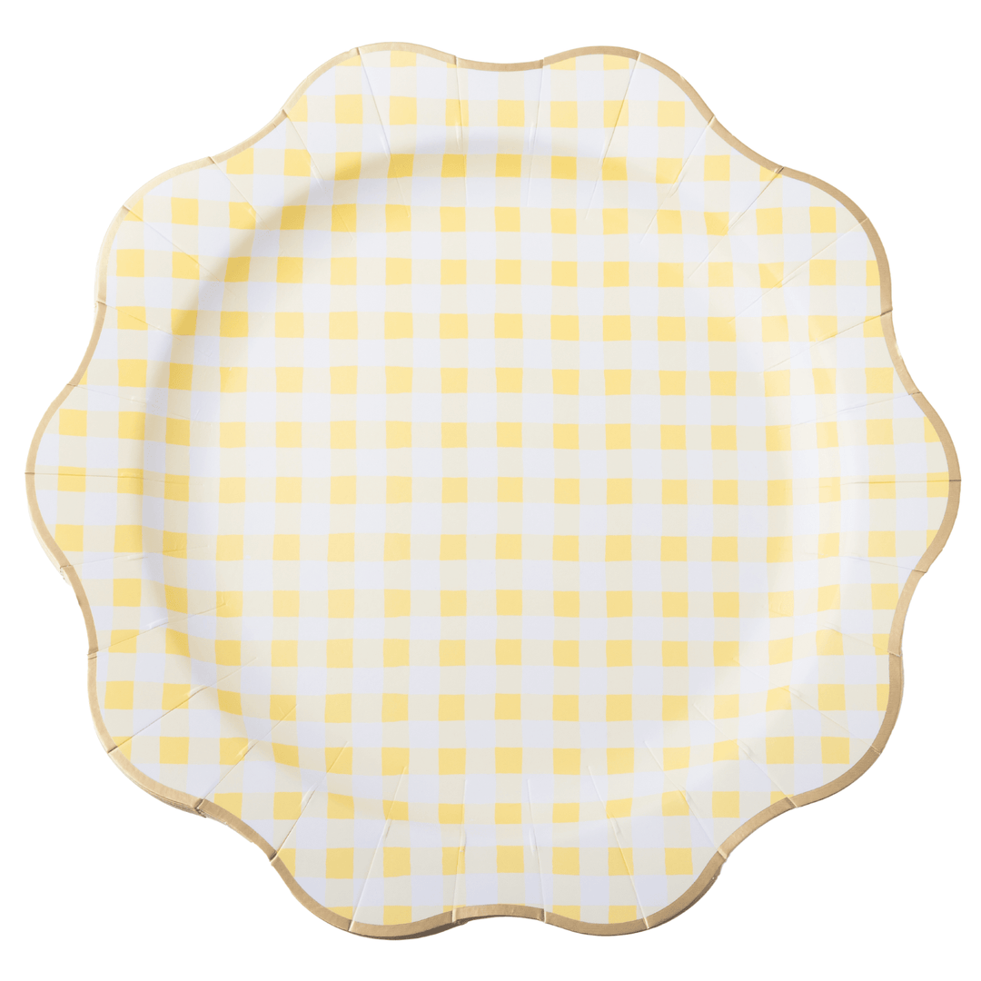 A scalloped paper plate with a yellow and white gingham check pattern and a light brown wood-look rim, shown on a solid white background.