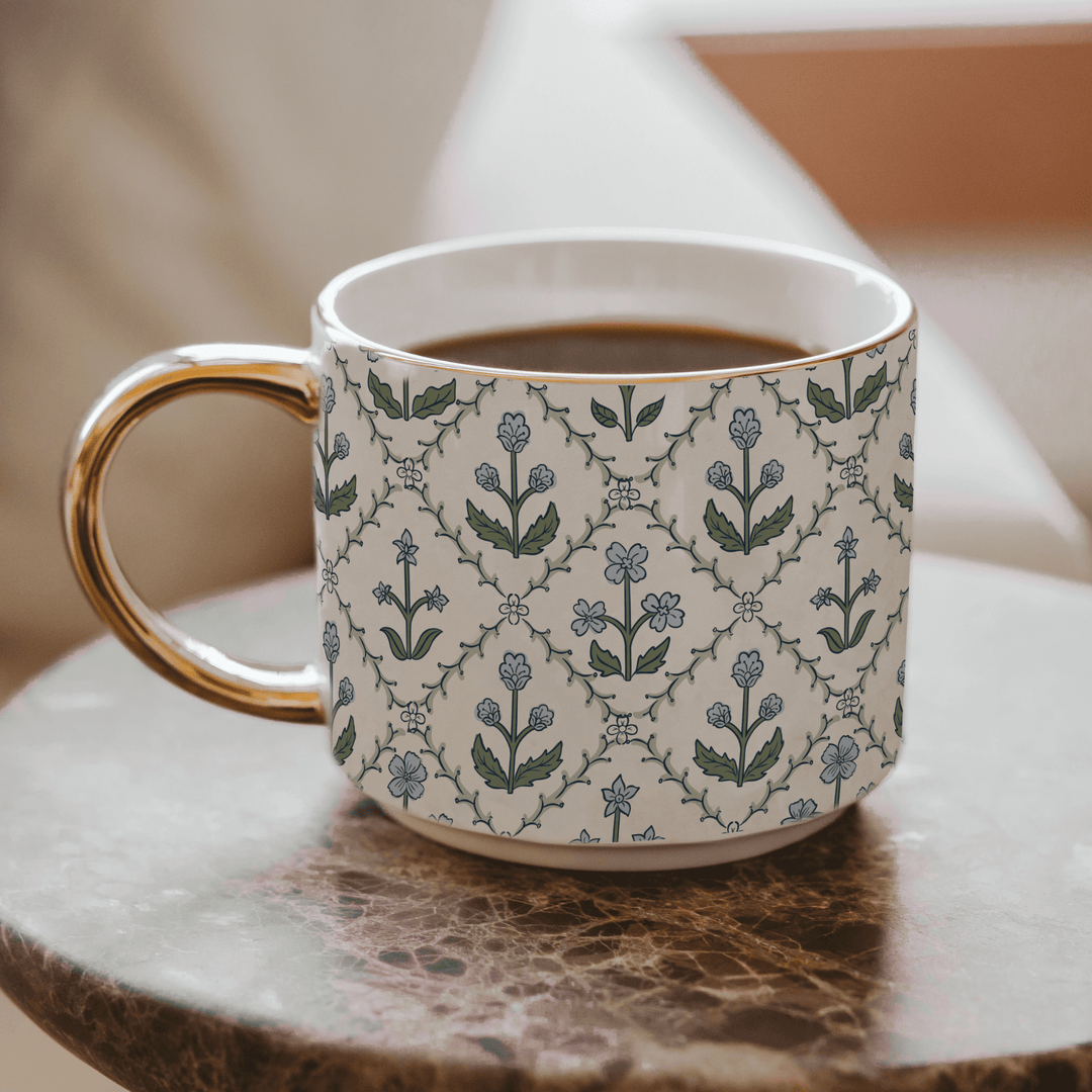 Blue floral quilted bone china mug with gold rim styled for spring