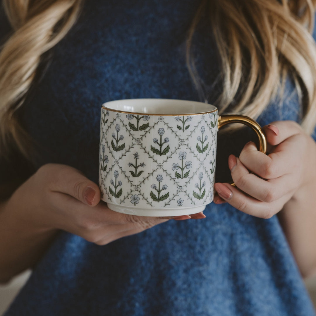 Blue floral quilt coffee mug styled in a cozy cottagecore kitchen