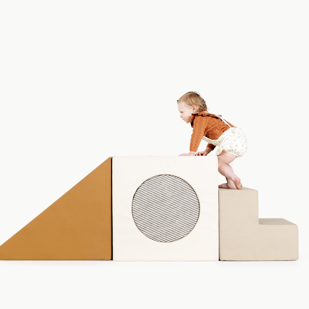 Gathre block playset with foam steps, a cube, and a triangle ramp in cream London print and rust