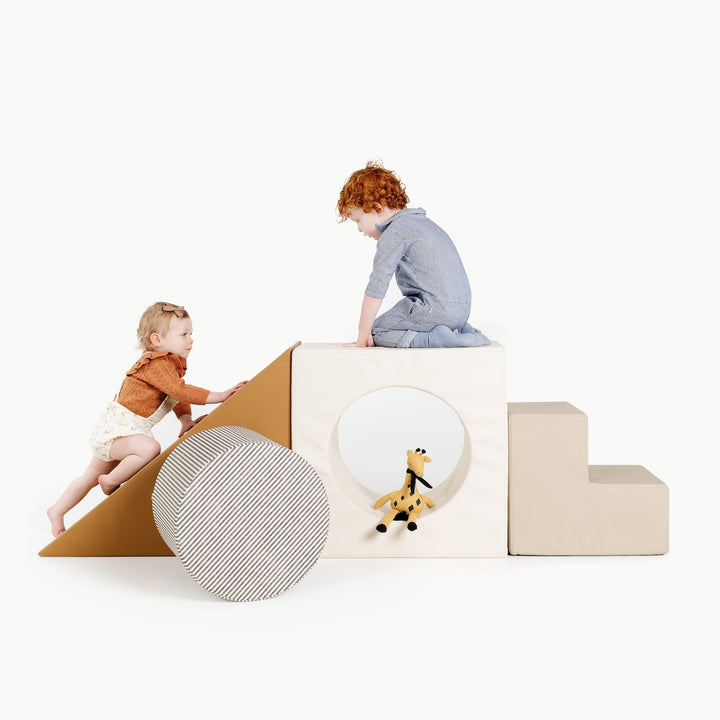Gathre block playset with foam steps, a cube, and a triangle ramp in cream London print and rust