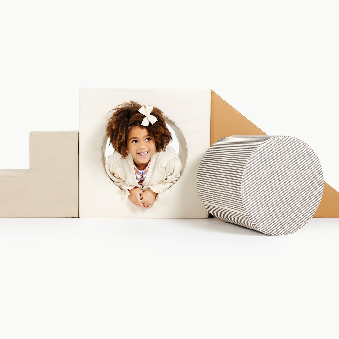 Gathre block playset with foam steps, a cube, and a triangle ramp in cream London print and rust