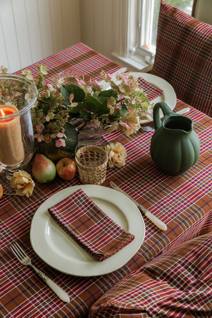 Charlotte plaid napkin at a place setting on the matching plaid tablecloth