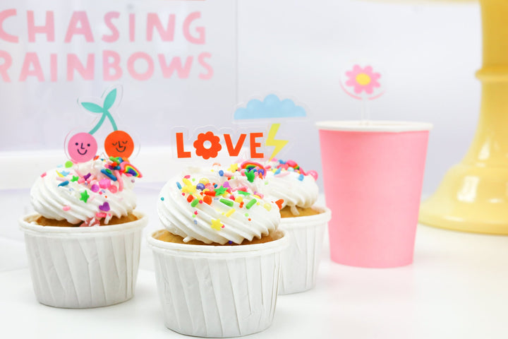 Acrylic rainbow cupcake toppers for a rainbow birthday dessert table