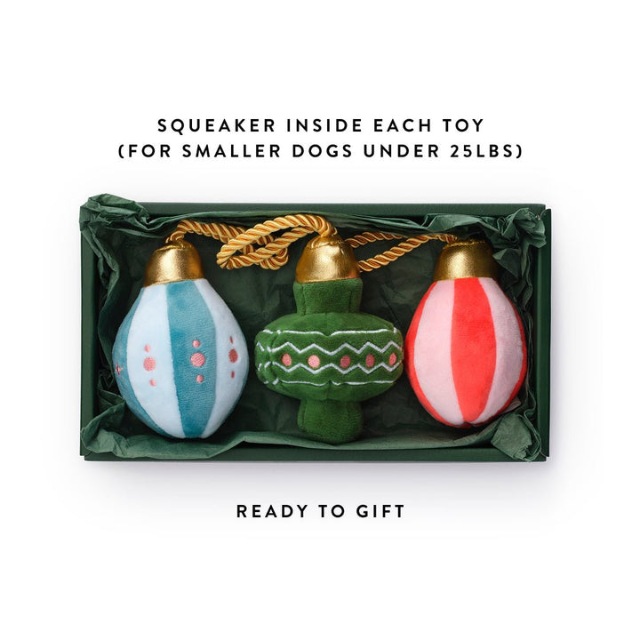 Open ornament toy box with gold rope loops, labeled squeaker inside each toy and ready to gift