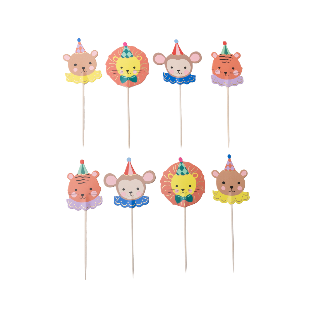 Six animal-themed party cupcake toppers on wooden sticks, featuring cartoon bears, lions, monkeys, and tigers wearing colorful party hats and ruffled collars, arranged in two rows on a white background.