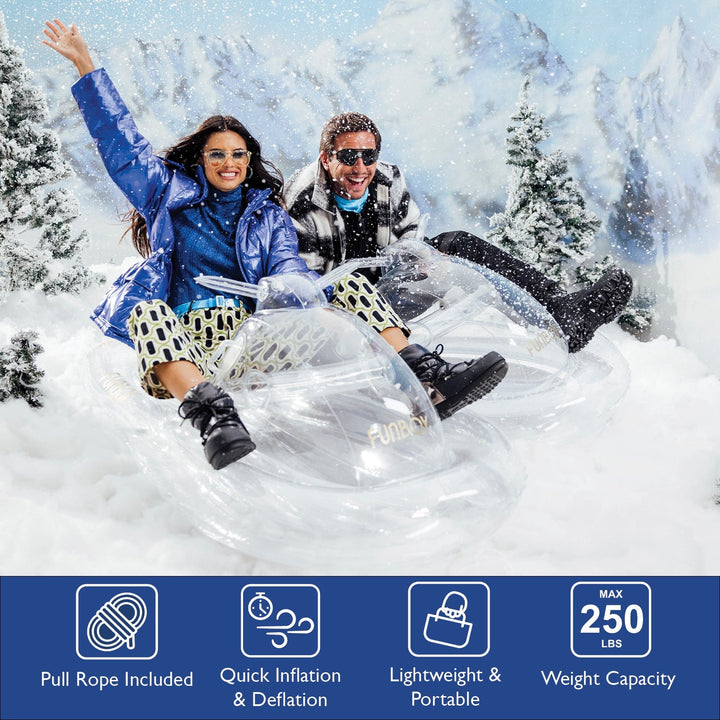 Two people riding a clear inflatable snowmobile sled with feature icons below
