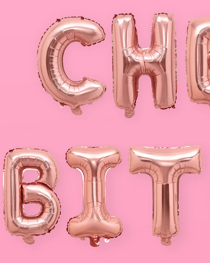 Close up of the rose gold cheers foil letter balloons