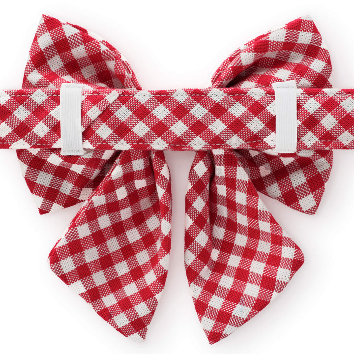 Back of the red gingham lady bow collar showing the elastic loops