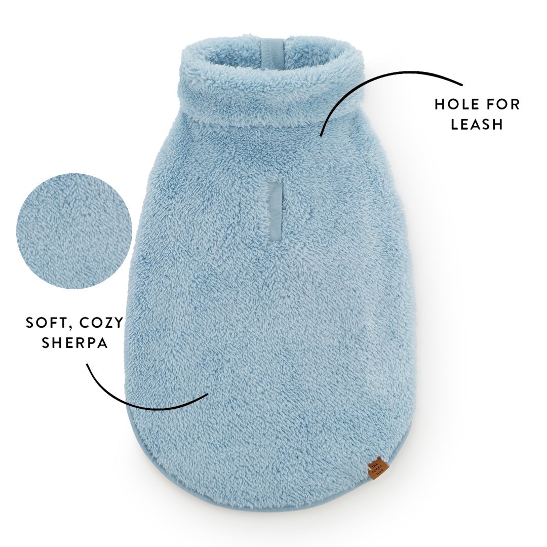 Callout of the sherpa jacket back showing the leash hole and the soft pile texture