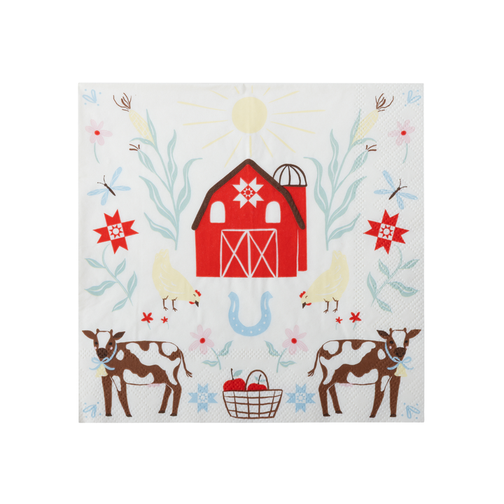 A square white paper napkin featuring a colorful country farm illustration with a red barn, cows, chickens, flowers, and a blue horseshoe.