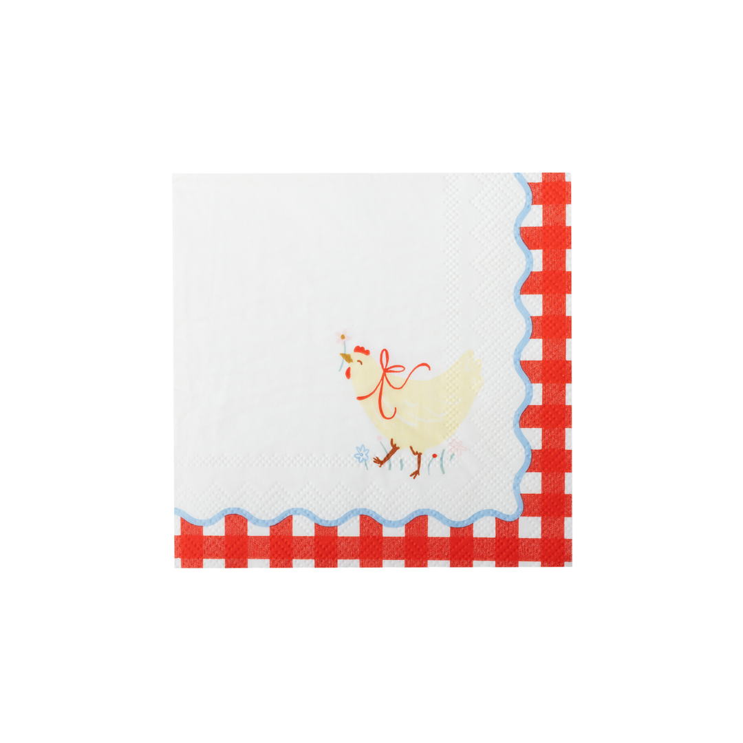 white paper napkins featuring a red and white gingham border, a scalloped blue edge, and a small yellow chicken illustration on the top.