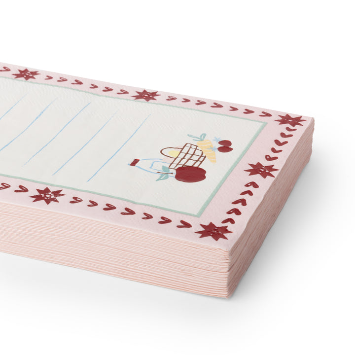 A stack of pink lined notepads napkins with a decorative border featuring red stars and a small cartoon character, shown on a clean white background.