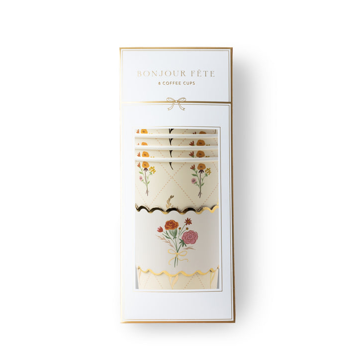 A boxed set of floral coffee cups and napkins on a clean white background. The packaging is white with gold trim and reads 'BONJOUR FÊTE & COFFEE CUPS'.