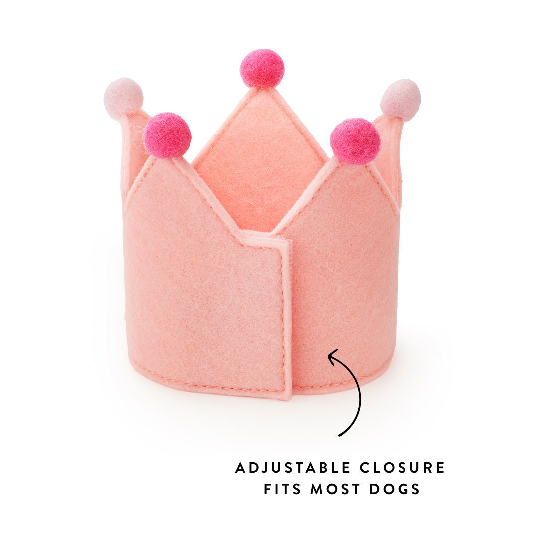 Back of the blush pink felt crown showing the hook and loop seam and an adjustable closure callout
